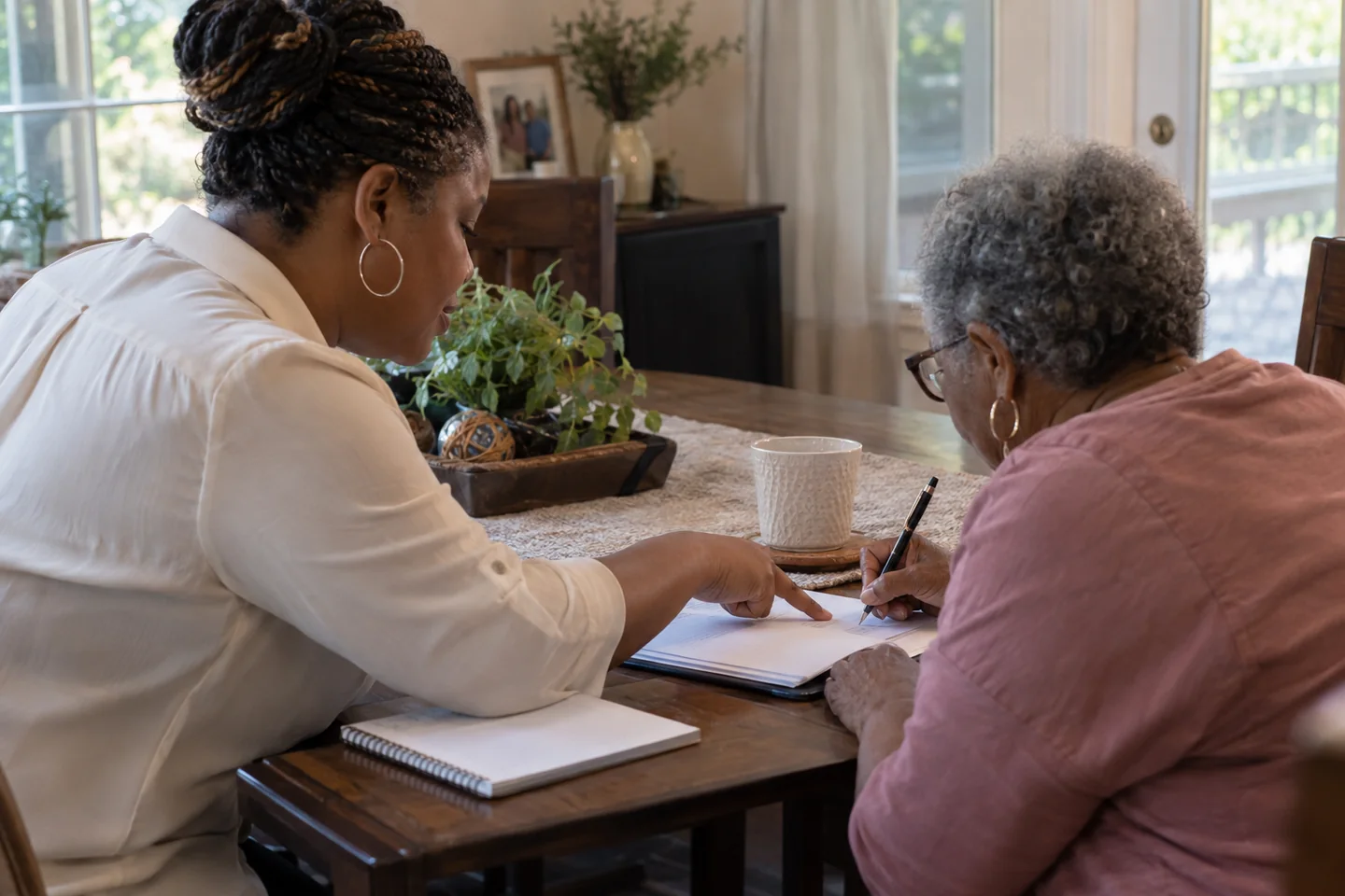 A mobile notary appointment taking place at a client's own table.